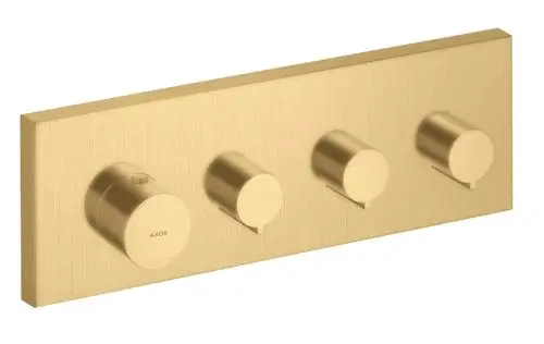 Thermostatmodul mit drei Drehreglern in gebürstetem Gold-Finish, montiert auf einer rechteckigen Platte. Hersteller: AXOR.